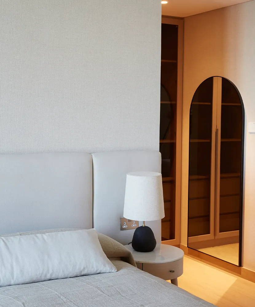 Spring Project, alternate view: light apartment interior in cream, blue, and pastel tones with marble dining table, Dubai