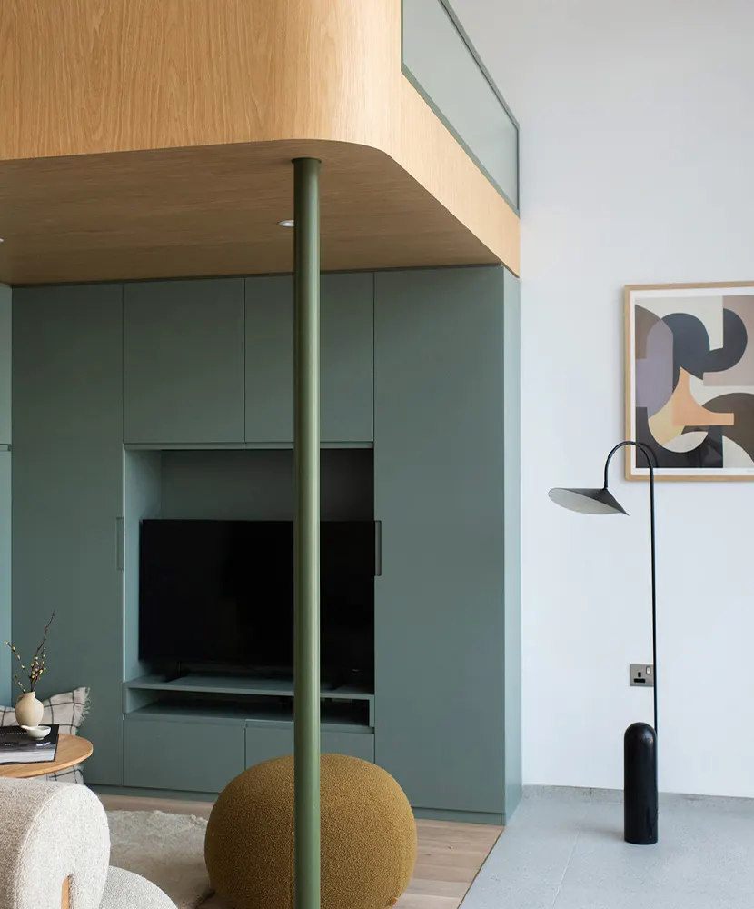 The Muse, alternate view: loft apartment with mezzanine and sage-green joinery, Dubai